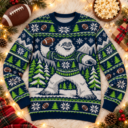 Yeti Snow Day football ugly Christmas sweater laid flat on a white faux-fur blanket with a football and popcorn