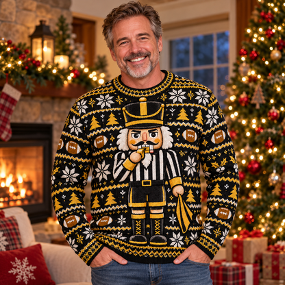Man wearing the Nutcracker Referee football ugly Christmas sweater in a cozy Christmas living room