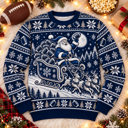 Santa Sleigh Full of Footballs football ugly Christmas sweater laid flat on a white faux-fur blanket with a football and popcorn